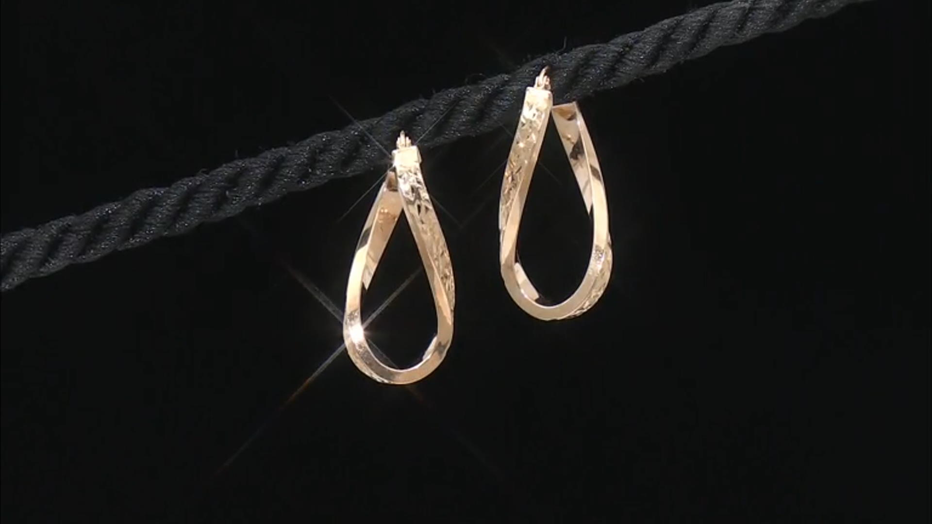 10k Yellow Gold Diamond-Cut Oval Twist Hoop Earrings Video Thumbnail