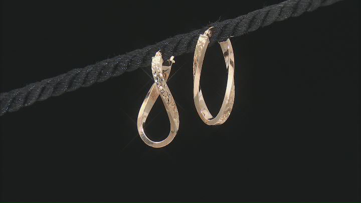 10k Yellow Gold Diamond-Cut Oval Twist Hoop Earrings Video Thumbnail