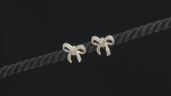 White Diamond Rhodium Over Sterling Silver Bow Earrings 0.15ctw Video Thumbnail