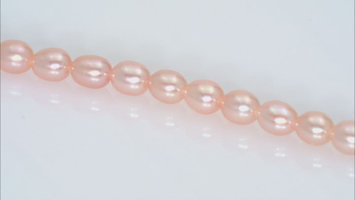 Peach 4-4.5x5-5.5mm Rice Shape Freshwater Cultured Pearl Bead Strand Approximately 16" in Length Video Thumbnail