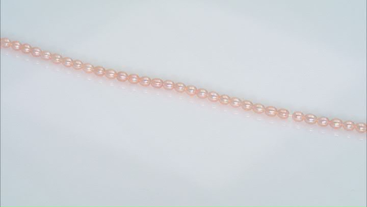 Peach 4-4.5x5-5.5mm Rice Shape Freshwater Cultured Pearl Bead Strand Approximately 16" in Length Video Thumbnail