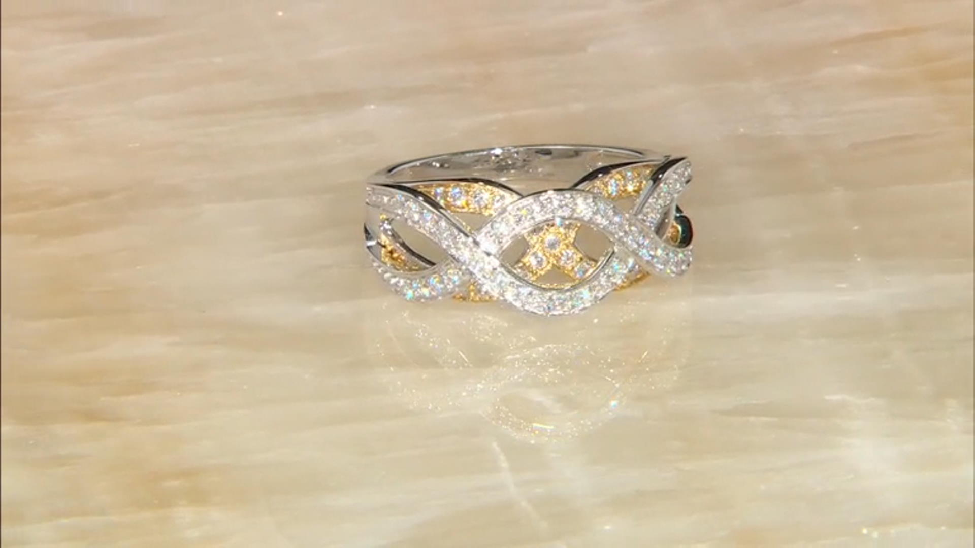 Moissanite platineve and 14k yellow gold over sterling silver crossover .63ctw DEW. Video Thumbnail